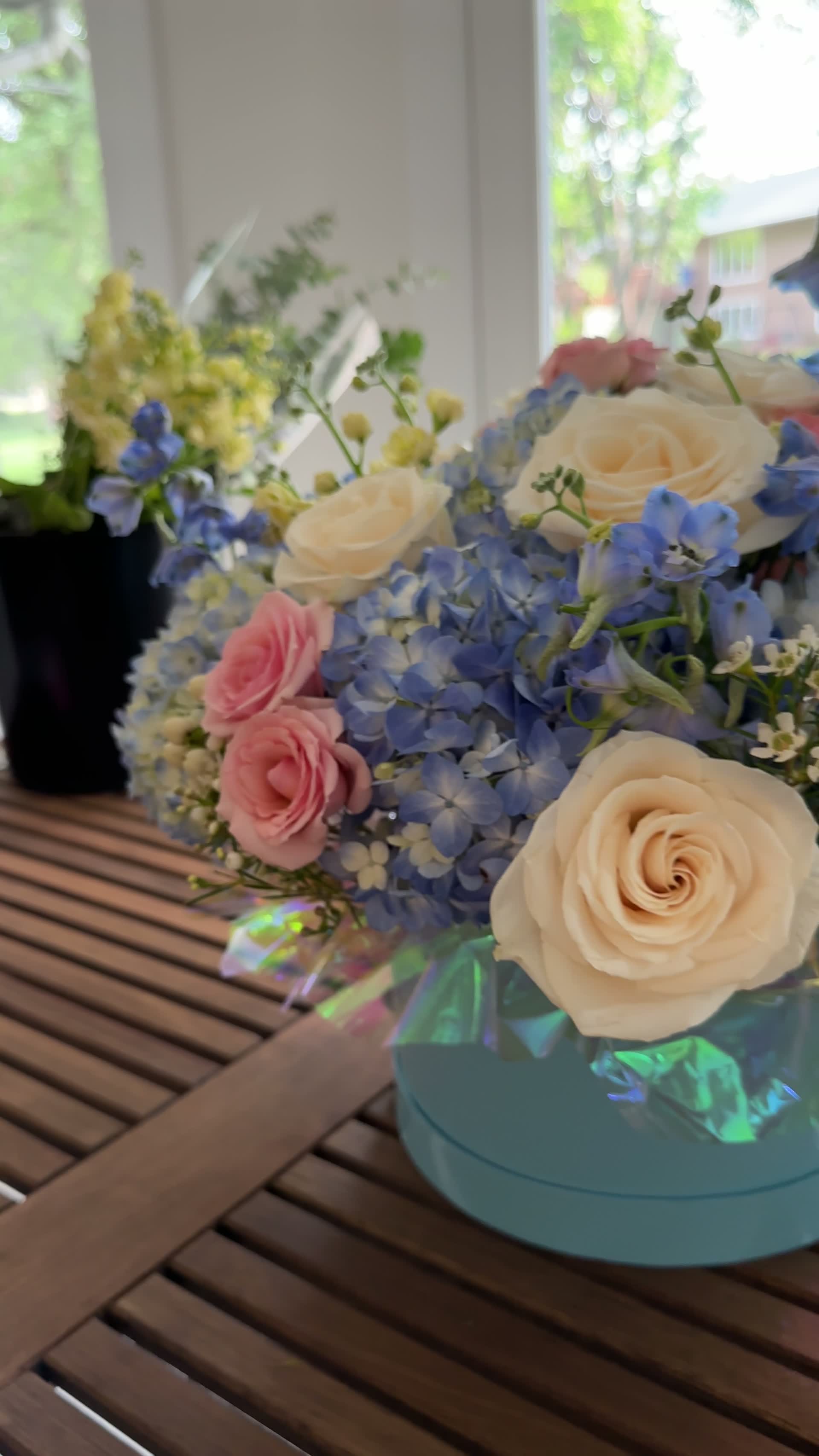 A pastel bouquet turning slowly in soft, cinematic light.